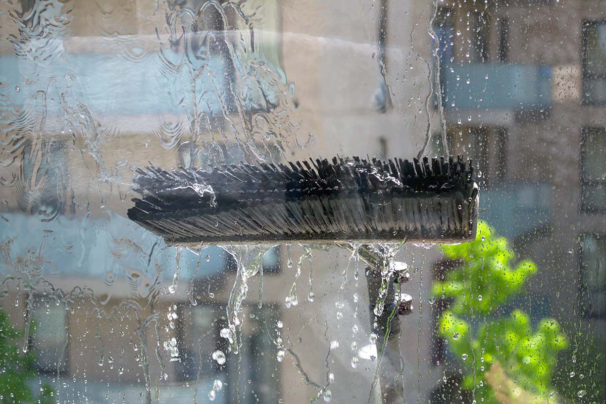 Window glass cleaning with pure water and extension pole. Washin